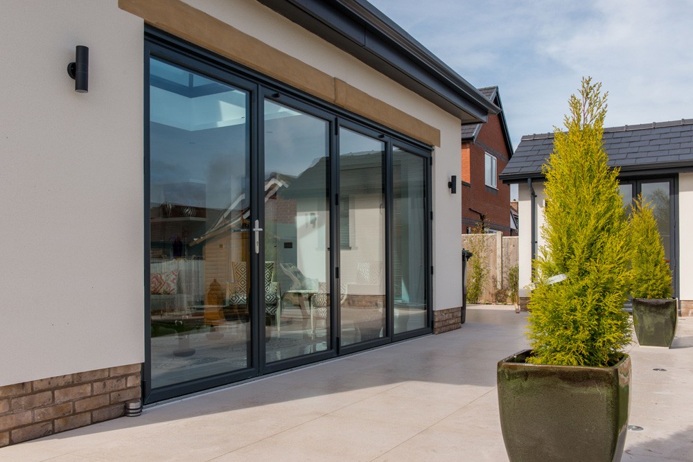 Hamiltons—What’s-the-Best-Material-for-Bifolds Why are aluminium bifolds the top choice for bifolding doors over uPVC & timber? Benefits of aluminium bifolds include strength, low maintenance, style & thermal performance. Find out more about how to enhance your home.